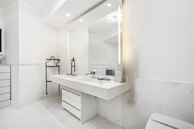 18555 Collins Ave Unit 5505, Sunny Isles Beach, FL 33160 - bathroom with recessed lighting, tile walls, double vanity, and toilet