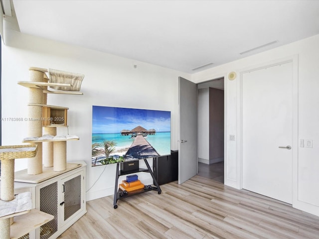 18555 Collins Ave Unit 5505, Sunny Isles Beach, FL 33160 - living area with wood finished floors and baseboards