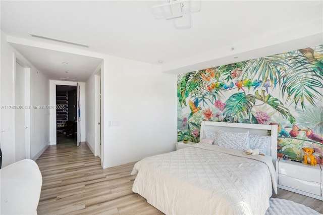 18555 Collins Ave Unit 5505, Sunny Isles Beach, FL 33160 - bedroom featuring light wood finished floors