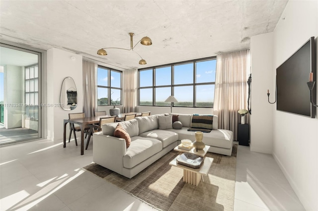 living room with light tile patterned floors and baseboards