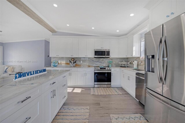 234 Allen Ave, Key Largo, FL 33037 - kitchen with crown molding, decorative backsplash, recessed lighting, and stainless steel appliances