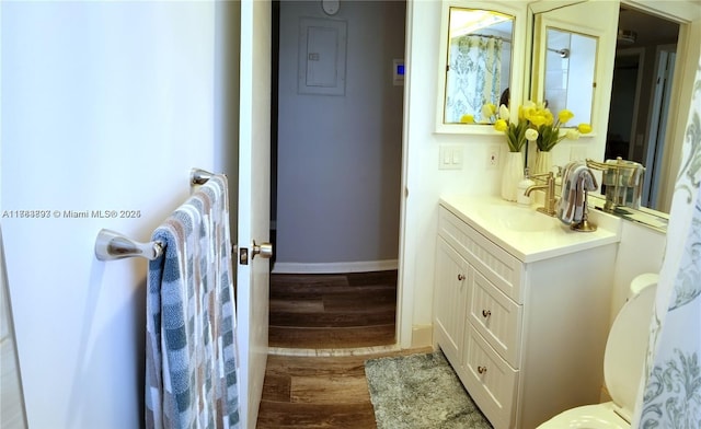 285 Fanshaw G 285G, Boca Raton, FL 33434 - bathroom with vanity, baseboards, and wood finished floors