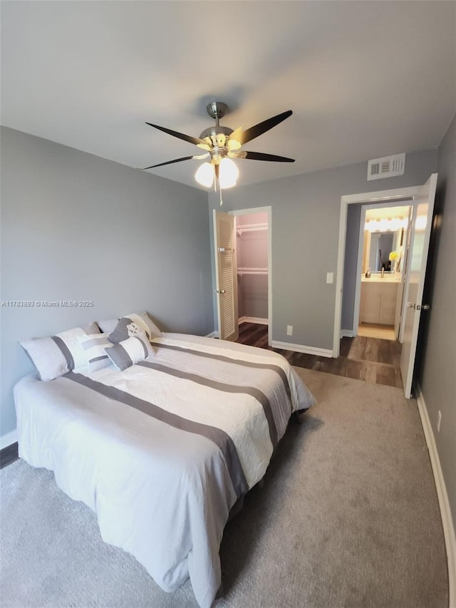 285 Fanshaw G 285G, Boca Raton, FL 33434 - bedroom with a walk in closet, baseboards, visible vents, and carpet floors