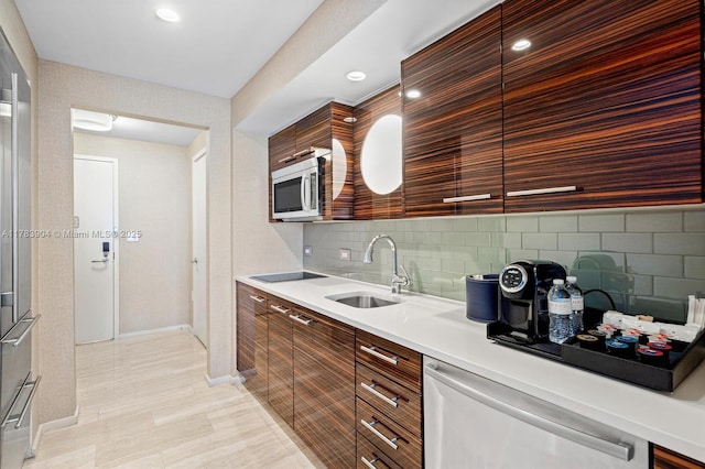 551 N Fort Lauderdale Beach Blvd Unit H1403, Fort Lauderdale, FL 33304 - kitchen with dishwasher, modern cabinets, stainless steel microwave, baseboards, and tasteful backsplash