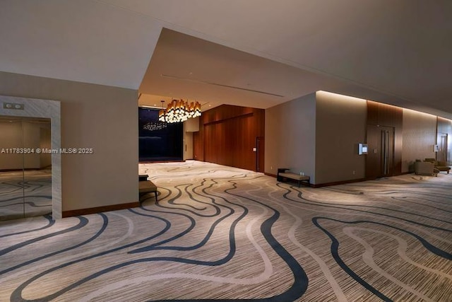 551 N Fort Lauderdale Beach Blvd Unit H1403, Fort Lauderdale, FL 33304 - corridor featuring baseboards, an inviting chandelier, and carpet floors