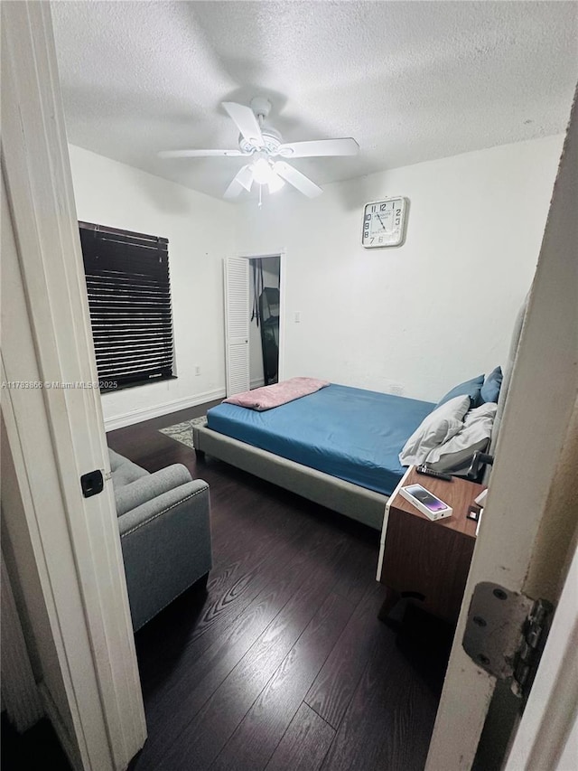 4371 SW 14th St, Miami, FL 33134 - bedroom with a ceiling fan, wood finished floors, and a textured ceiling