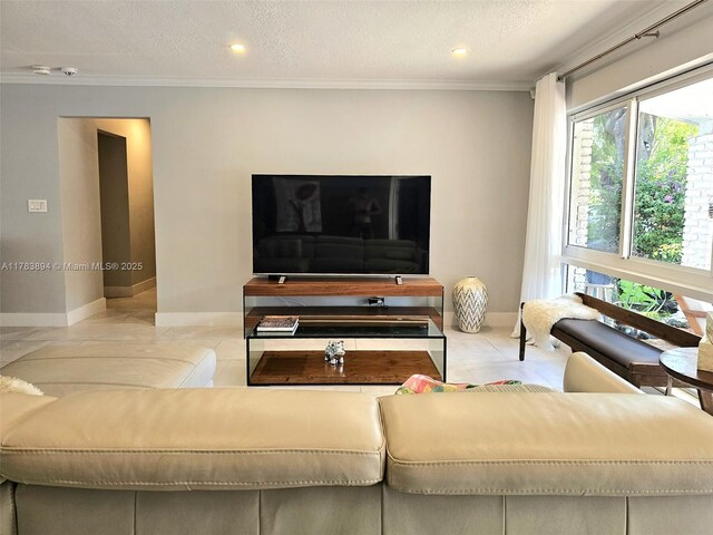 3602 NE 18th Ave, Oakland Park, FL 33334 - living area featuring recessed lighting, baseboards, crown molding, and a textured ceiling