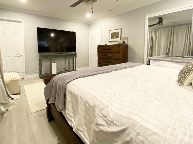 3602 NE 18th Ave, Oakland Park, FL 33334 - bedroom with crown molding, wood finished floors, a ceiling fan, and recessed lighting