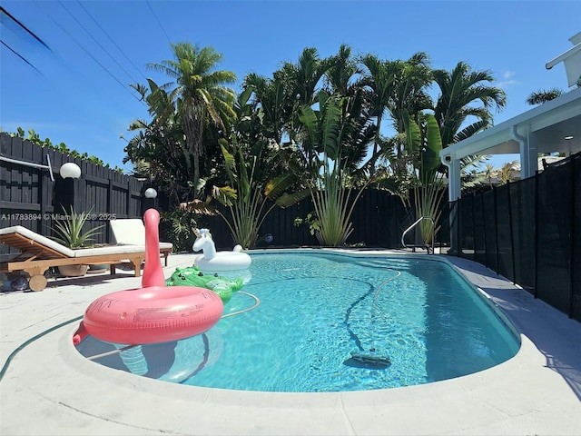 3602 NE 18th Ave, Oakland Park, FL 33334 - view of swimming pool with a patio, a fenced backyard, and a fenced in pool