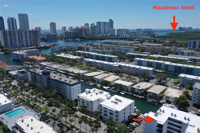 aerial view featuring a city view and a water view