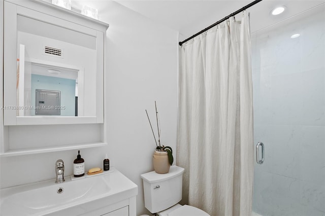 full bath with toilet, vanity, visible vents, and a stall shower