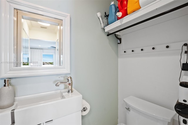bathroom featuring toilet and a sink