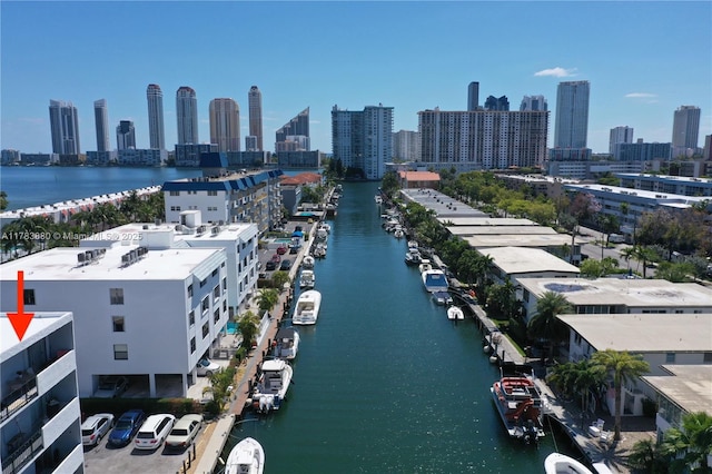 drone / aerial view featuring a water view and a city view