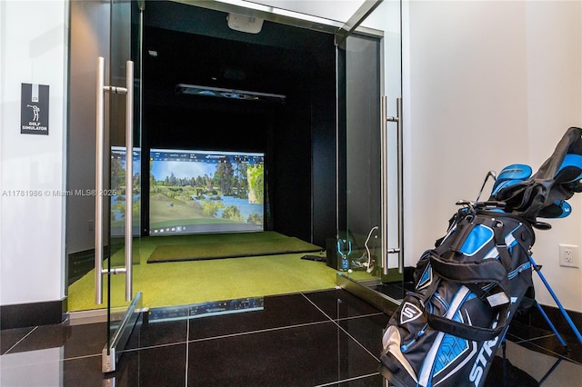 game room with golf simulator