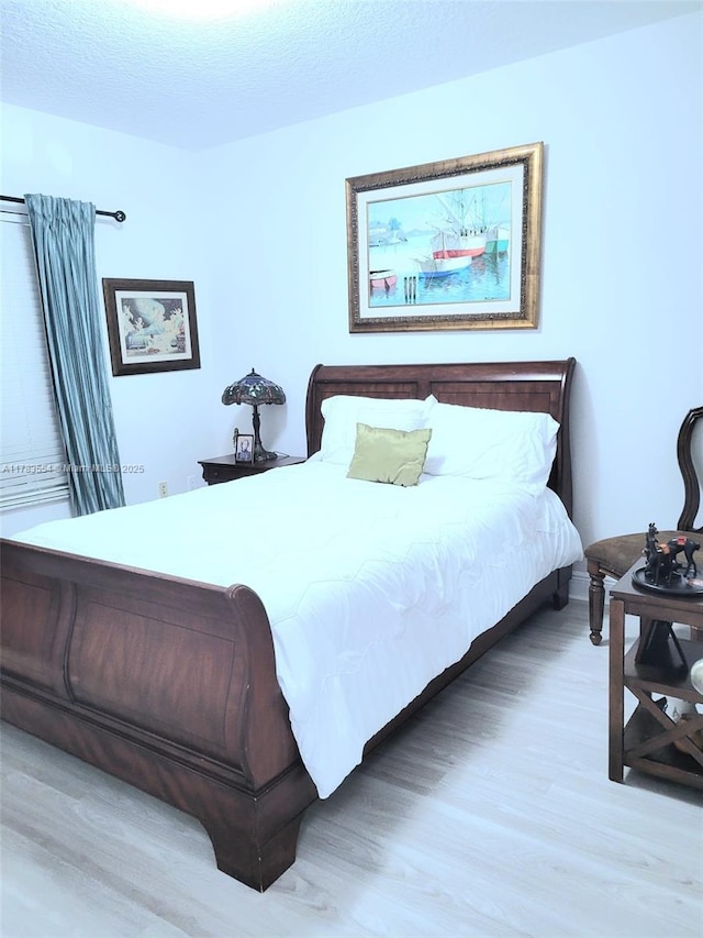 bedroom with light wood-style flooring