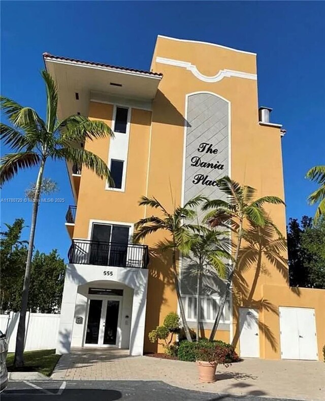 view of building exterior with fence