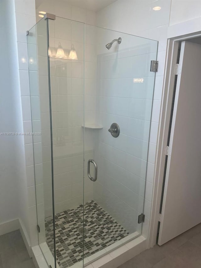 555 E Dania Beach Blvd Unit 4, Dania Beach, FL 33004 - bathroom with a shower stall and tile patterned floors