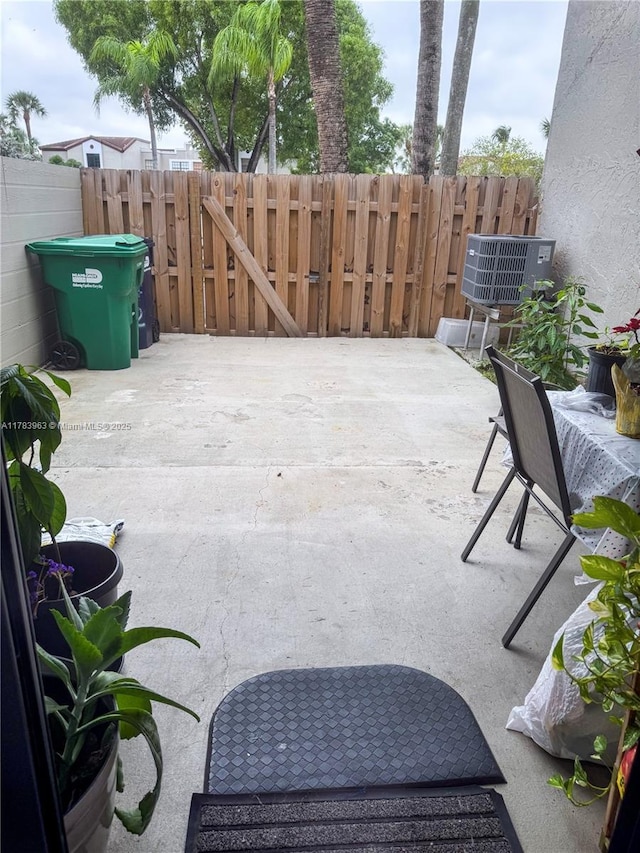 10505 SW 153rd Ct Unit 2, Miami, FL 33196 - view of patio / terrace with cooling unit and fence