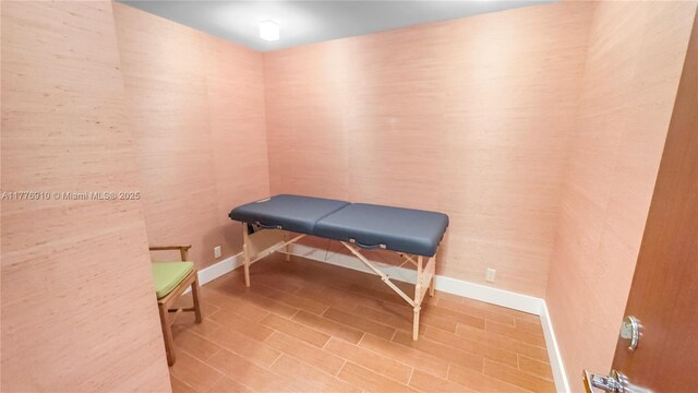 19667 Turnberry Way Unit 3F, Aventura, FL 33180 - miscellaneous room with baseboards and wood finished floors