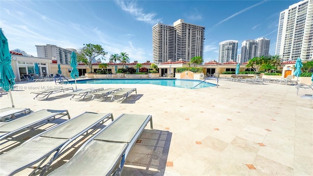 19667 Turnberry Way Unit 3F, Aventura, FL 33180 - community pool featuring a patio and a view of city