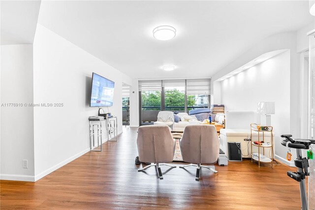19667 Turnberry Way Unit 3F, Aventura, FL 33180 - living room featuring wood finished floors and baseboards