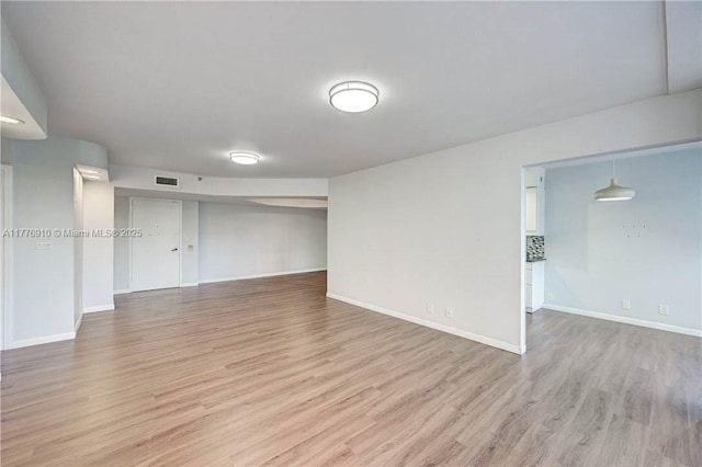19667 Turnberry Way Unit 3F, Aventura, FL 33180 - empty room with light wood-style flooring and baseboards