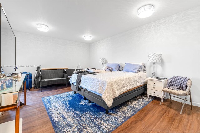 19667 Turnberry Way Unit 3F, Aventura, FL 33180 - bedroom with wood finished floors and baseboards