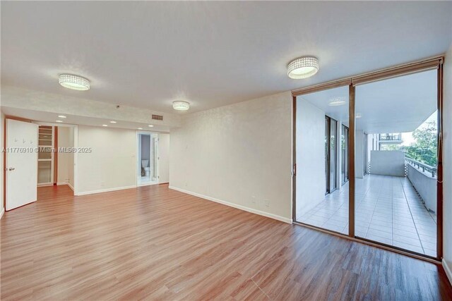 19667 Turnberry Way Unit 3F, Aventura, FL 33180 - unfurnished room with light wood-type flooring and baseboards