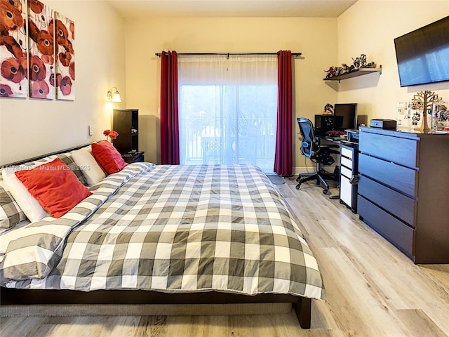 bedroom featuring light wood-style flooring
