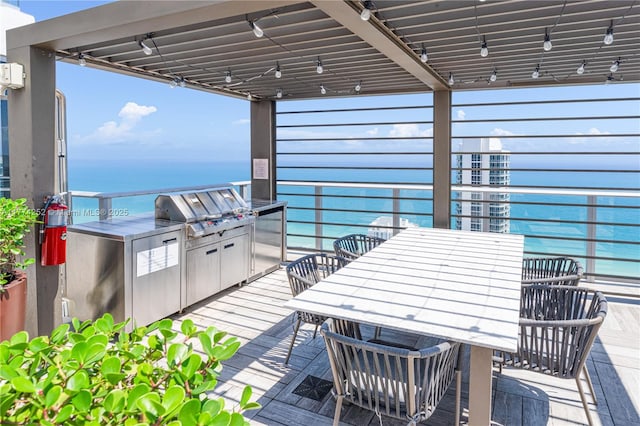 4010 S Ocean Dr Unit T3609, Hollywood, FL 33019 - view of patio with an outdoor kitchen, grilling area, outdoor dining space, and a water view