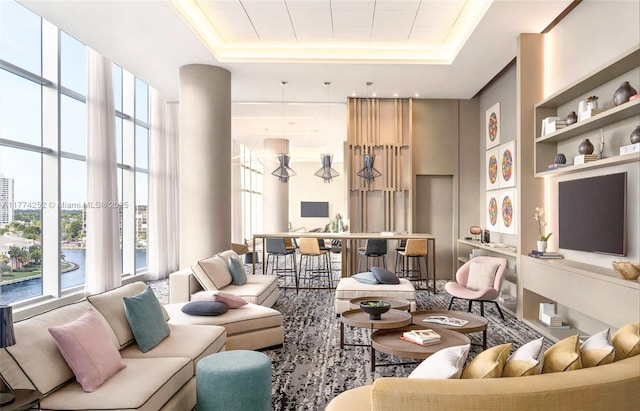 4010 S Ocean Dr Unit T3609, Hollywood, FL 33019 - living area featuring a raised ceiling, a healthy amount of sunlight, and built in shelves