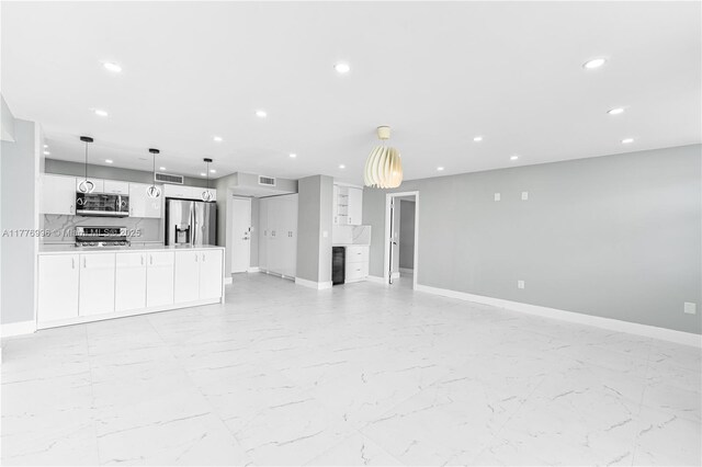 2851 NE 183rd St Unit 1504E, Aventura, FL 33160 - unfurnished living room featuring recessed lighting, baseboards, and light marble finish flooring