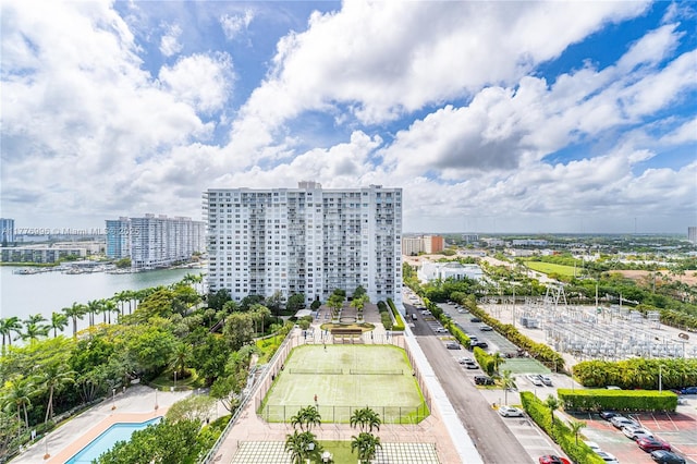 birds eye view of property featuring a water view and a view of city