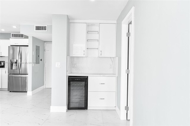 2851 NE 183rd St Unit 1504E, Aventura, FL 33160 - kitchen featuring stainless steel fridge, wine cooler, light marble finish floors, white cabinets, and recessed lighting