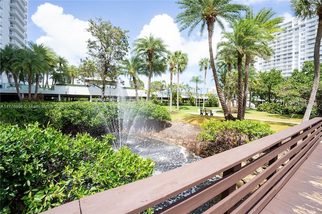 view of property's community with a yard