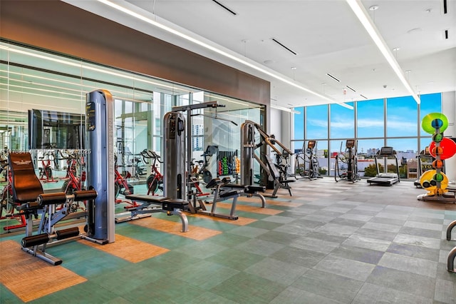exercise room with floor to ceiling windows