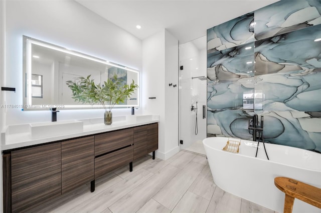 2138 SW 3rd Ave, Cape Coral, FL 33991 - bathroom with double vanity, a soaking tub, and a shower stall