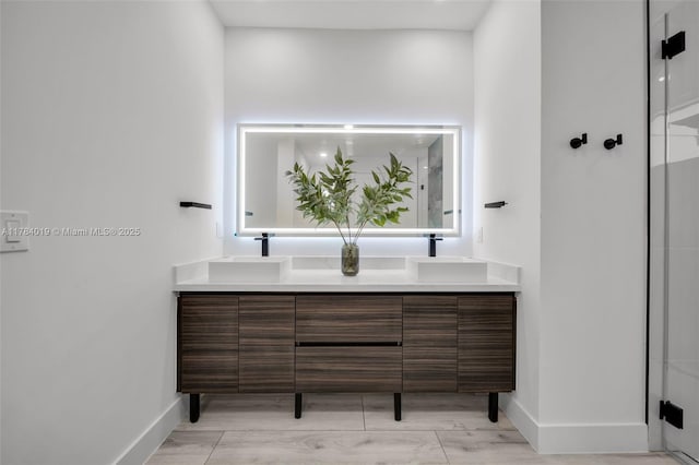 2138 SW 3rd Ave, Cape Coral, FL 33991 - full bathroom featuring double vanity and a shower with shower door