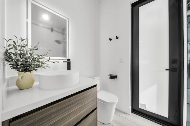 2138 SW 3rd Ave, Cape Coral, FL 33991 - bathroom featuring vanity and toilet