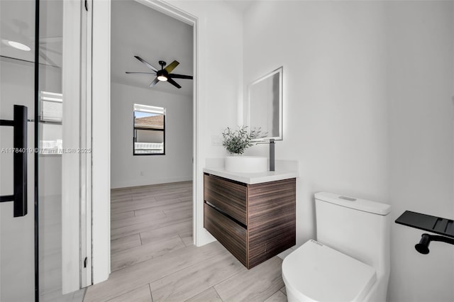 2138 SW 3rd Ave, Cape Coral, FL 33991 - bathroom with vanity, ceiling fan, and wood finished floors