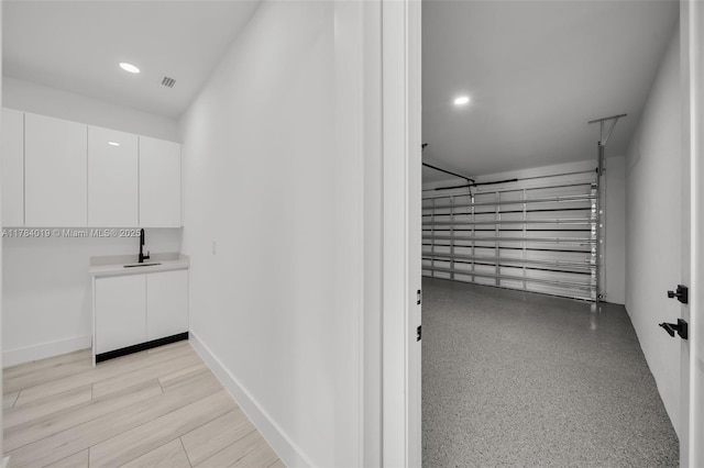 2138 SW 3rd Ave, Cape Coral, FL 33991 - garage with a sink and recessed lighting