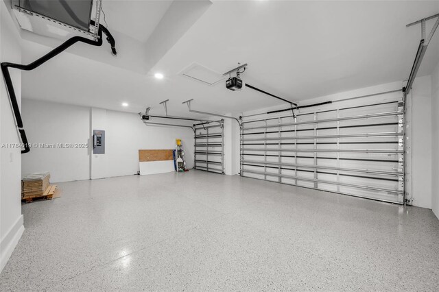 2138 SW 3rd Ave, Cape Coral, FL 33991 - garage with a garage door opener, electric panel, and recessed lighting