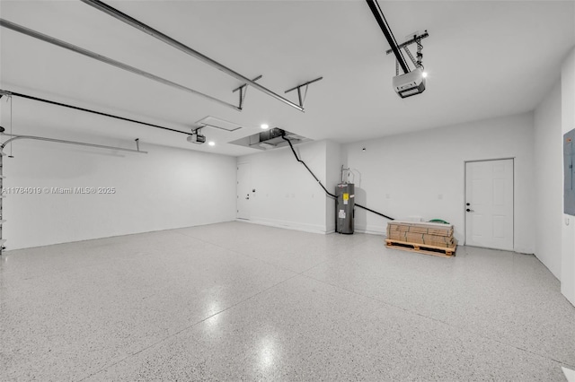 2138 SW 3rd Ave, Cape Coral, FL 33991 - garage featuring water heater, a garage door opener, and electric panel