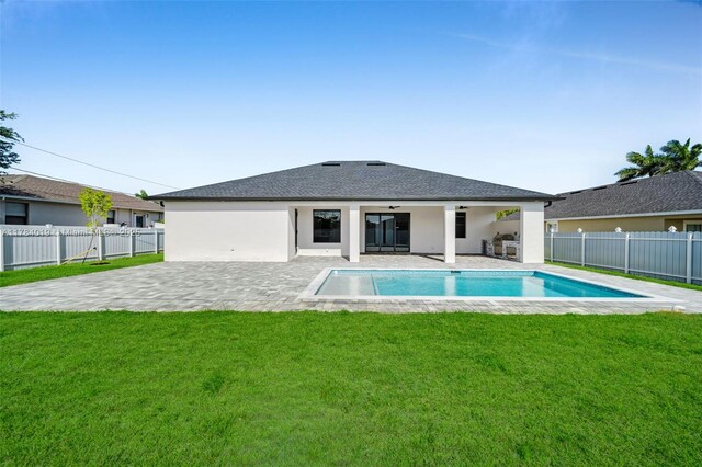 2138 SW 3rd Ave, Cape Coral, FL 33991 - back of house with a patio area, a fenced backyard, ceiling fan, stucco siding, and roof with shingles