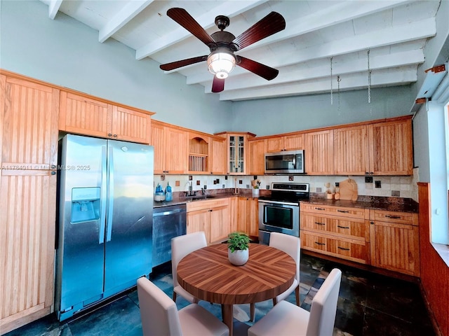 6208 SW 26th St, Miramar, FL 33023 - kitchen featuring stainless steel appliances, beamed ceiling, dark countertops, a ceiling fan, and glass insert cabinets