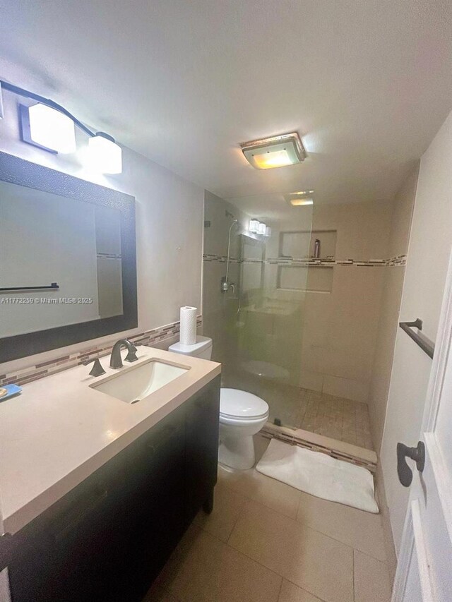 470 N Laurel Dr Unit 6A, Margate, FL 33063 - full bath featuring vanity, toilet, a shower stall, and tile patterned floors