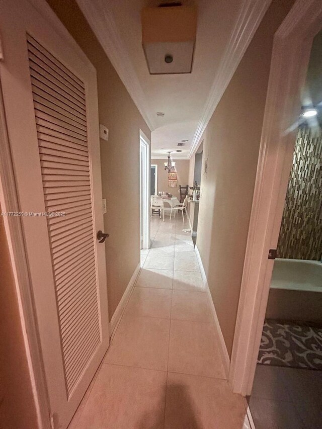 470 N Laurel Dr Unit 6A, Margate, FL 33063 - hall featuring ornamental molding, light tile patterned floors, and baseboards