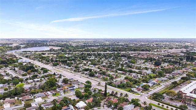 bird's eye view featuring a residential view and a water view