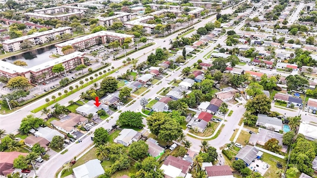 birds eye view of property with a residential view and a water view