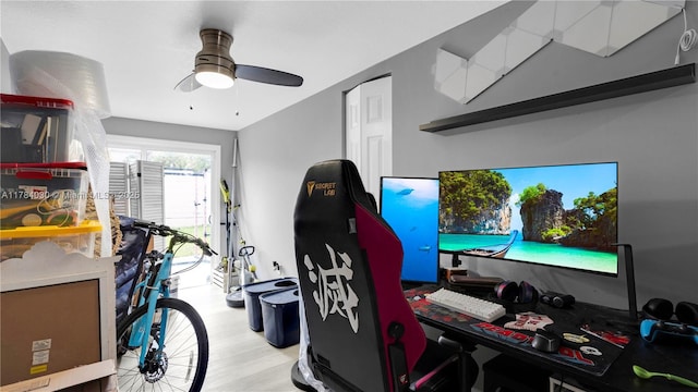 interior space with a ceiling fan and light wood-style floors